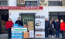 La Asociación Multicultural Cascamorras Baza y Coviran donan alimentos a Cáritas